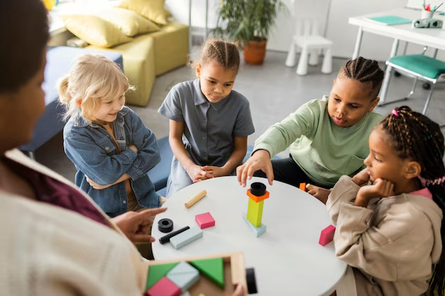 Children playing wooden game at the table